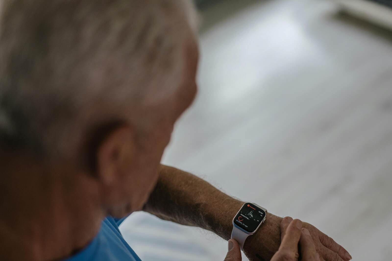 Senior comparing a medical alert watch vs smartwatch in 2026