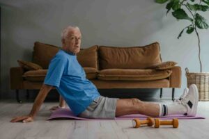 Senior performing strength training exercises at home